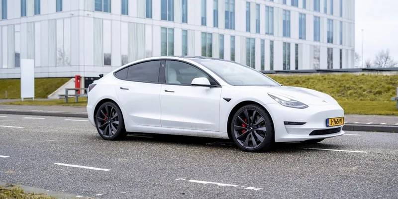 An electric car driving on an open road