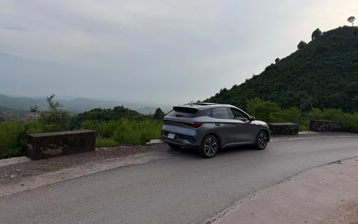 The BYD Atto 3 on a winding hill road on the way up to Murree